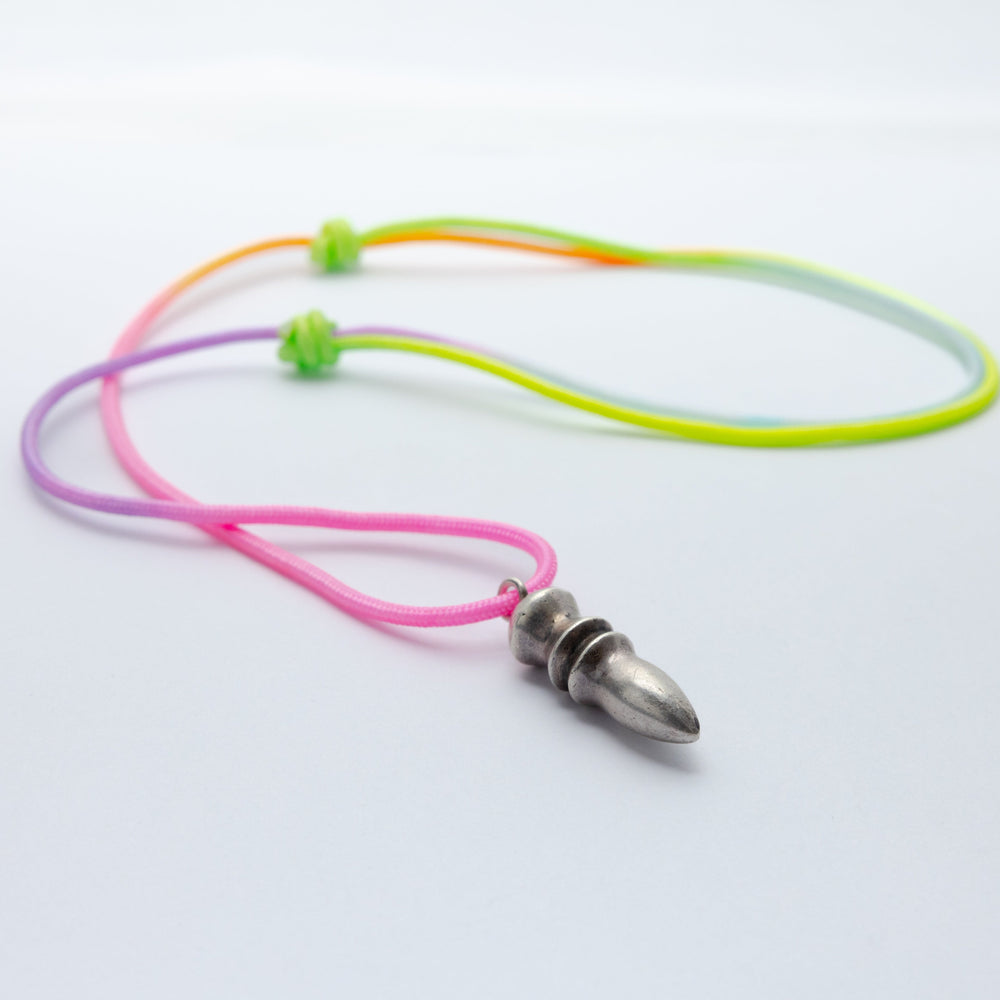 Neon-colored lanyard with a silver bullet-shaped pendant on a white background